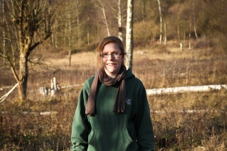 Elaine stands on a nature reserve