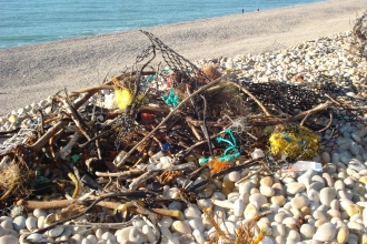 Pile of litter on Chesil Beach © Sally Welbourn