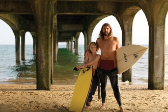 Father and son with surf boards