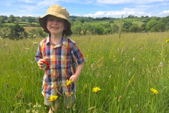 Bryn playing in a meadow