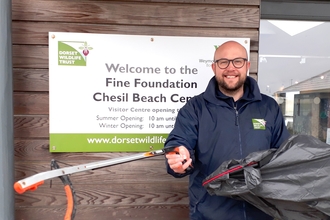 Marc Kativu-Smith going on a beach clean at Chesil by Dan Bartlett