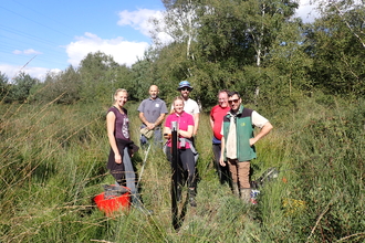 Volunteers installing dipwells