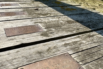 Chesil boardwalk with plaque 