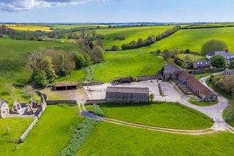 Lyscombe river valley and chapel with farm buildings and views across to Dorchester