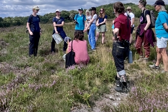 Upton Heath warden talking to group of people on the heath