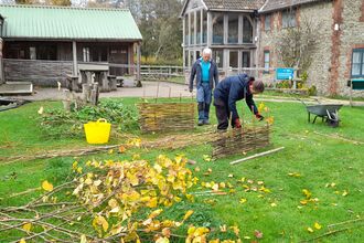 Volunteers working outside at Kingcombe Visitor Centre