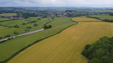 Aerial photo of the Court Farm site featuring fields and hedgerows