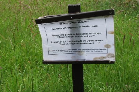 Sign to say not forgotten to cut grass Living Churchyard