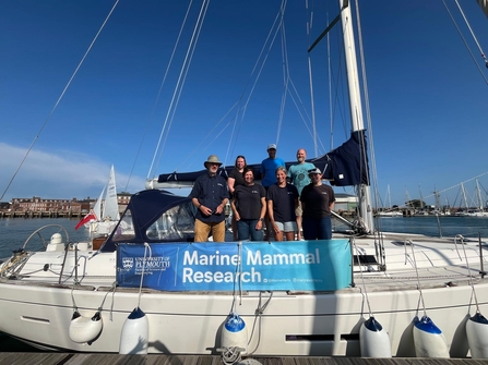 Showing boat and the survey team on Take the Helm