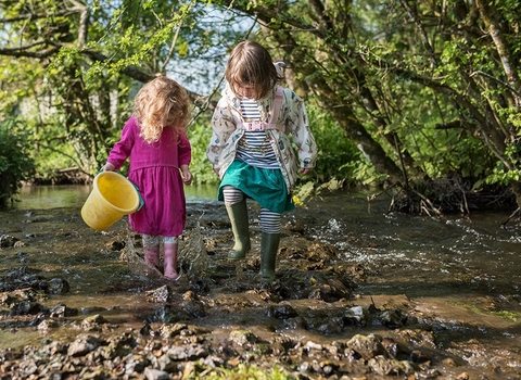 Children playing in the River Hooke by Katharine Davies 