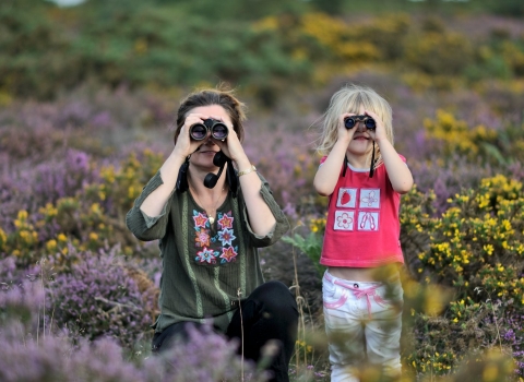 Family bird watching on heathland in summer © David Tipling/2020VISION